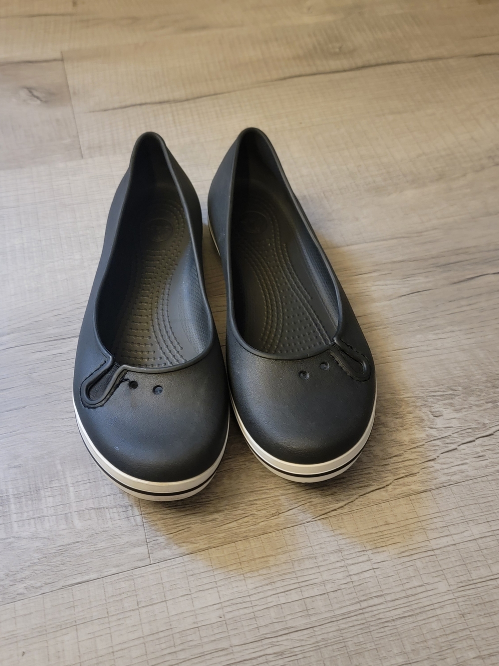 CROCS Women's Black Ballet Flat with White Stripe Sole